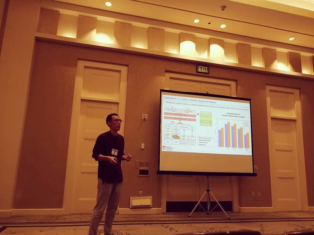 Me standing on stage at ICME 2018 San Diego delivering the presentation of our AI research paper